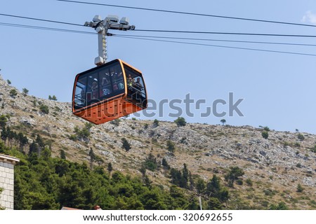 DUBROVNIK, CROATIA - AUGUST 13, 2015: Tourists at Cable car which connects Dubrovnik and mountain Srdj above town.