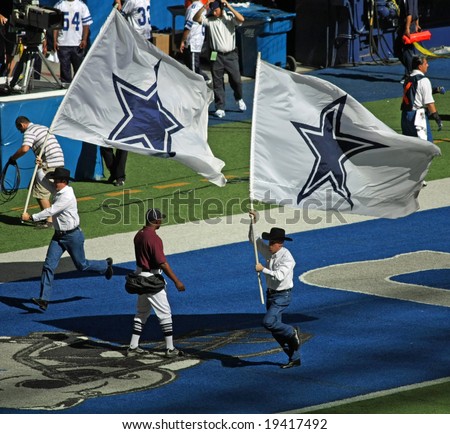 DALLAS - OCT 5: Texas Stadium in Irving, Texas on Sunday, October 5, 2008. Two men celebrate after a Dallas Cowboys touchdown. The last season that the Cowboys will play in Texas Stadium.