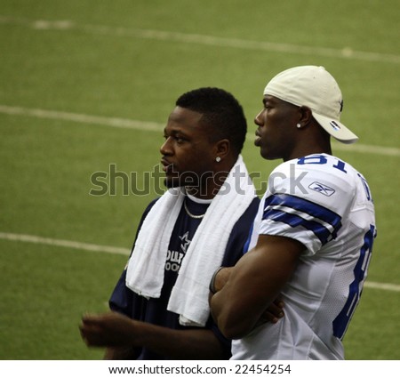 DALLAS - DEC 14: Sunday, December 14, 2008. Dallas Cowboys receiver Terrell Owens on the sideline during a game with the NY Giants talking with Pacman Jones. Taken in Texas Stadium.