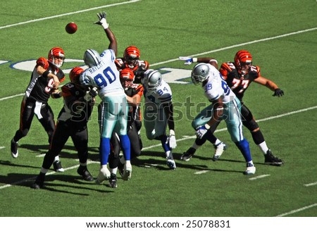 DALLAS, TEXAS - OCT 5: Cincinnati Bengals quarterback Palmer passes the football against the Dallas Cowboys defense during a game at Texas Stadium, Irving, Texas on October 5, 2008.