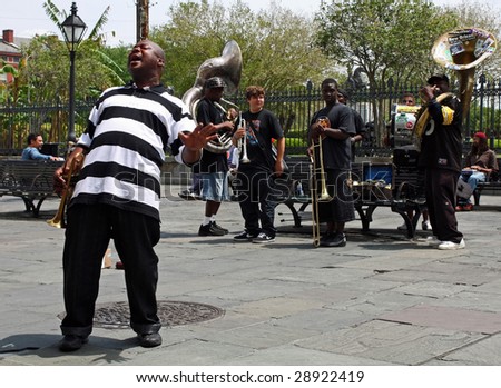 NEW ORLEANS, LOUISIANA - APRIL 13: A jazz band plays in Jackson Square April 13, 2009 in New Orleans, Louisiana after recovery from hurricane Katrina just before the Jazz and Heritage Festival.