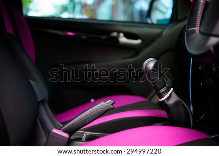 Car interior with back seats tone pink and black
