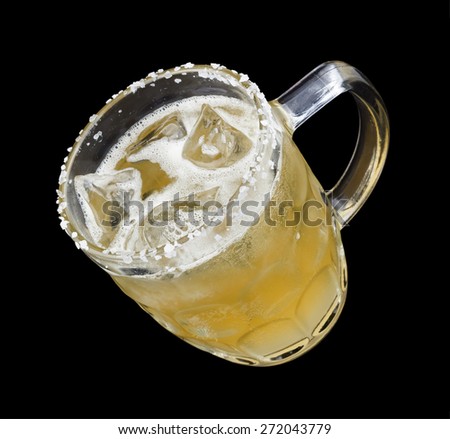 Lagerita is a cocktail that contains tequila, Cointreau, lime juice, beer in a salt-rimmed glass. Isolated on black.