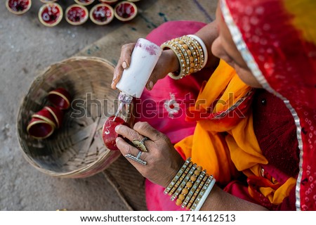 Similar – Image, Stock Photo Craftswoman painting a bowl made of clay in art studio