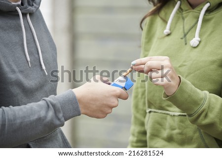 Similar – Foto Bild Teenager-Mädchen mit Rauchzeichen am Strand