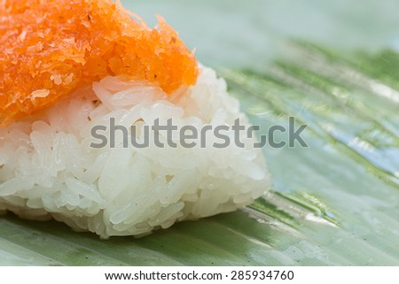 Sticky rice with Shrimp and shred coconut , wrapped in banana