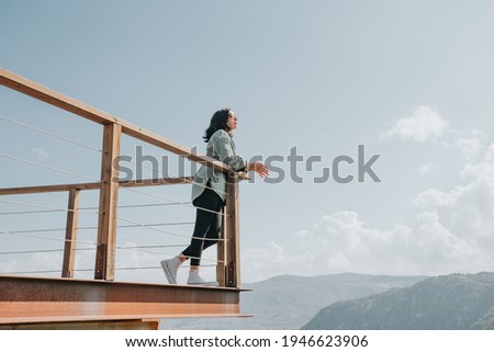 Similar – Image, Stock Photo People looking from balcony to landscape