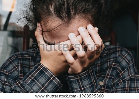 Similar – Image, Stock Photo Woman worried while showing off the window in the city during a spring day, mental health concept