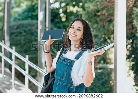 Similar – Image, Stock Photo University entry Portrait of a Smart Beautiful arab Girl Holding Study Text Books Smiling Looking at the Camera. Authentic Student has a lot to study and read, for Class Assignment, Exams Preparation