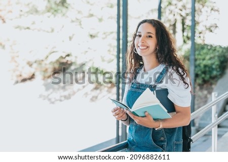 Similar – Image, Stock Photo University entry Portrait of a Smart Beautiful arab Girl Holding Study Text Books Smiling Looking at the Camera. Authentic Student has a lot to study and read, for Class Assignment, Exams Preparation