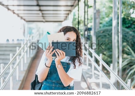 Similar – Image, Stock Photo University entry Portrait of a Smart Beautiful arab Girl Holding Study Text Books Smiling Looking at the Camera. Authentic Student has a lot to study and read, for Class Assignment, Exams Preparation