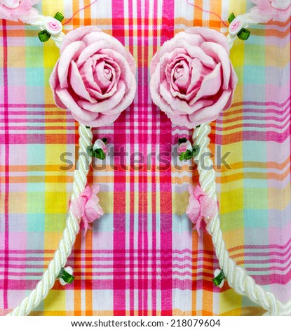 background pattern of Fabric line  with artificial flowers rose