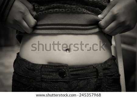 Pull-up show navel of young woman