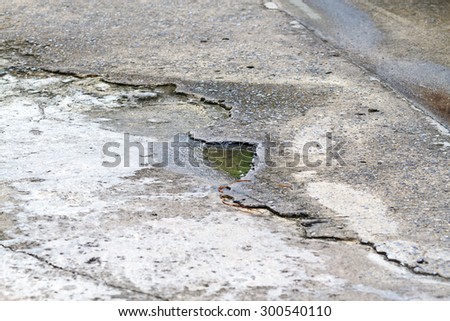 water at the cracks of the concrete road