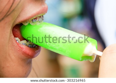 Close up of teeth are eaten ice cream.