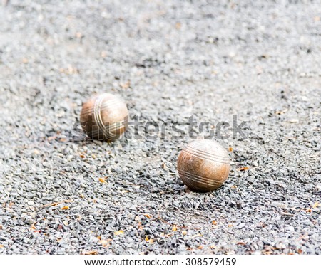 the bocce balls or Metallic petanque balls on fine stone field