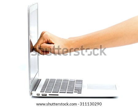 woman fist hit to the monitor of the laptop on white table