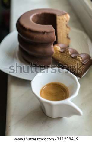 Coffee break with single espresso shot and sweet german tree cake (baumkuchen) for cheer your day up