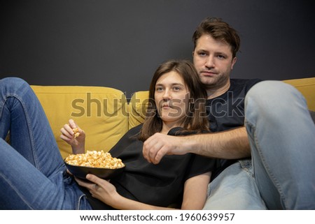 Similar – Image, Stock Photo Unemotional couple sitting on asphalt road in city