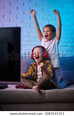 Similar – Image, Stock Photo Little gamer celebrating victory in VR game