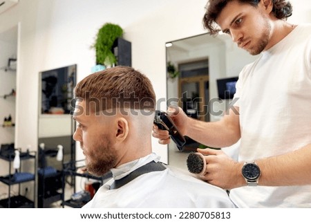 Similar – Image, Stock Photo Ethnic barber trimming mustache of client in hairdressing salon