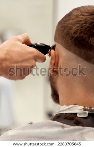 Similar – Image, Stock Photo Ethnic barber trimming mustache of client in hairdressing salon