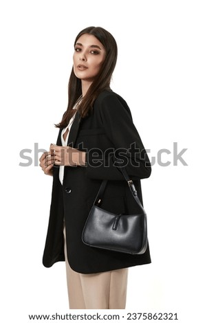 Similar – Image, Stock Photo A gorgeous brunette model is posing flawlessly next to some chopped trees. Her see-through black dress, fancy high heels, and pretty face are the main subjects of the photograph though. Eyes contact with a camera and a comfy feeling gives more intimacy.