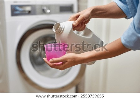 Similar – Image, Stock Photo The freshly washed pink t-shirt shows the white underpants to the old washcloth, in front of a blue sky, how to hang wet and fragrant on the rope of the washing line to dry in good weather.