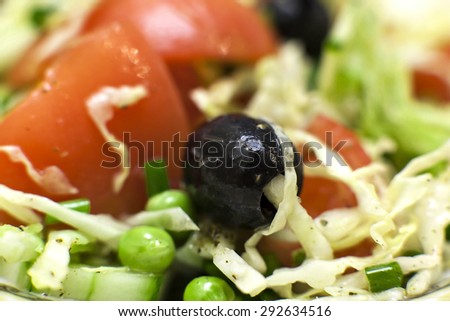 a fresh salad of tomatoes and Greek olives