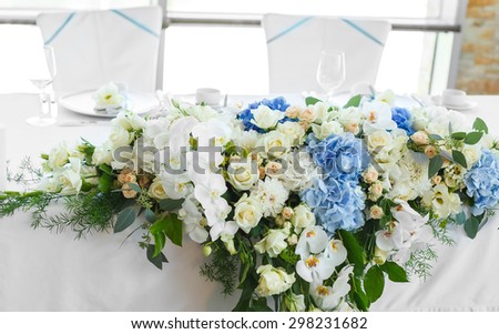 white and blue flowers in wedding decoration