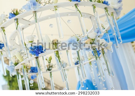 chandelier of flowers for wedding arch