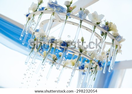 chandelier of flowers for wedding arch