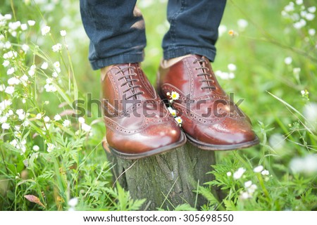 brown mens wedding shoes in the grass
