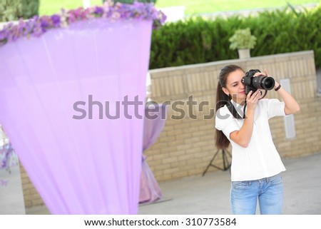Wedding photographer taking photographs of wedding