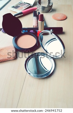 Makeup Eyeliner brush with bottle ,set of cosmetics,Make-up and brushes,powder, puff, mascara, eyeliner  on  wood table