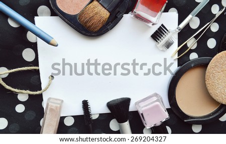 set of cosmetics, contraceptives, blank sheet of paper