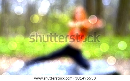 athletic, young, girl doing exercises on the nature.lurred background of sporty girl.