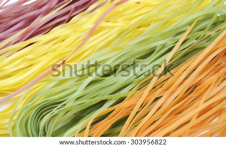 Italian Colorful  tagliatelle pasta texture background.dry vegetable pasta .