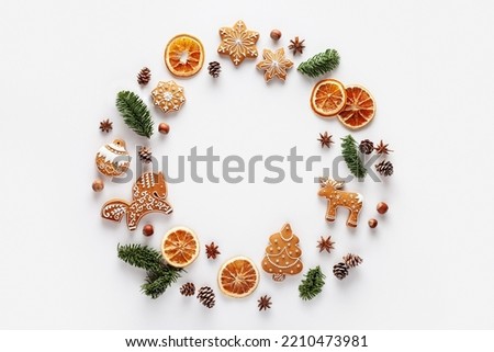 Similar – Image, Stock Photo Christmas composition. Wreath made of fir tree branches and festive pine cones on a red background, top view