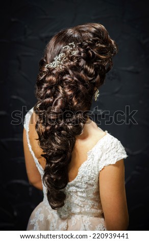 Beautiful bride with fashion wedding hair-style, studio portrait