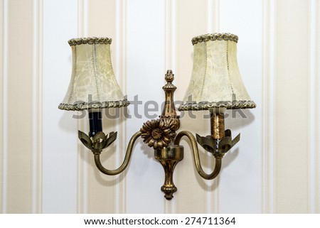 Old-fashioned wall lamp in the room, home decoration