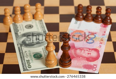 One Hundred US Dollar vs Chinese One Hundred Yuan on a Chess Board