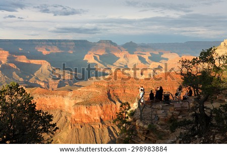 Grand Canyon, Arizona - July 4, 2015: A Group of Tourist Watching Sunset at Yavapai Point at South Rim. Yavapai point is one of the best panoramas of the inner canyon and the Colorado River