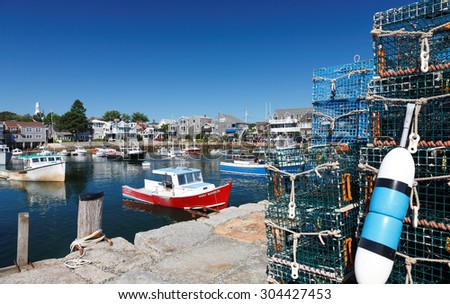 Rockport, Massachusetts - August 8, 2015: Rockport Harbor Showing Lobster Traps and Boats on a Sunny Morning, Rockport, Massachusetts, USA.