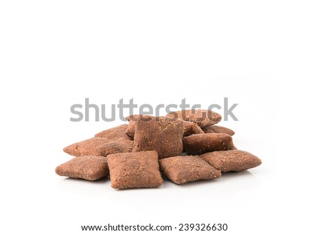 Crispy chocolate cereal pillow flakes on white background