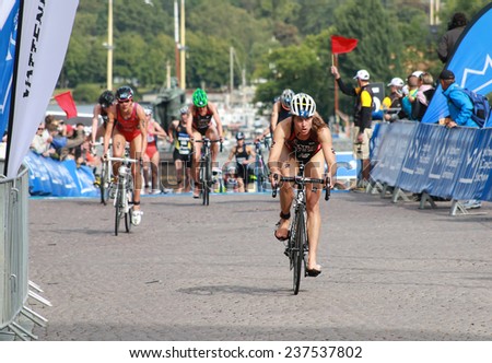 STOCKHOLM - AUG 23: Sarah Groff in the lead after the transition in the Women\'s ITU World Triathlon series event August 23, 2014 in Stockholm, Sweden