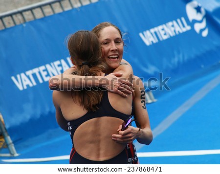 STOCKHOLM - AUG 23: Sarah Groff hugging Lindsay Jerdonik after winning the Women\'s ITU World Triathlon series event August 23, 2014 in Stockholm, Sweden