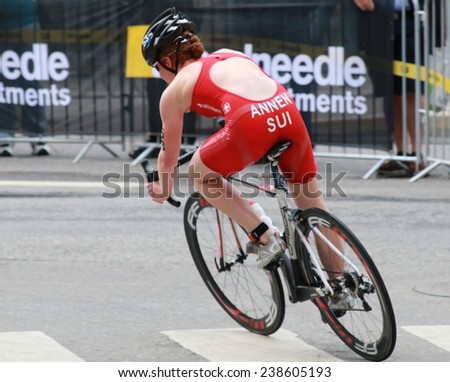 STOCKHOLM - AUG 23, 2014: Jolanda Annen (SUI) cycling in a curve in the Women\'s ITU World Triathlon series event August 23, 2014 in Stockholm, Sweden