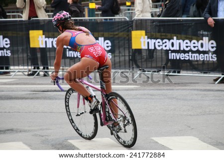 STOCKHOLM - AUG 23, 2014: Maria Ortega (ESP) cycling in a curve in the Women\'s ITU World Triathlon series event August 23, 2014 in Stockholm, Sweden