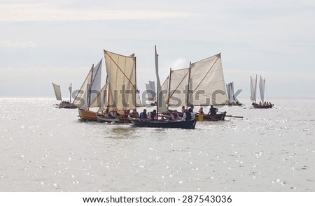 GRISSLEHAMN - JUN 13, 2015: Large group of old sailing ships in a chotic situation in bright light rowing from Sweden to FInland in the public event Postrodden, June 13, 2015 in Grisslehamn, Sweden